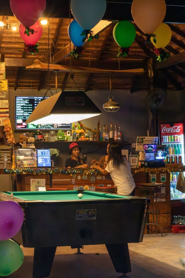 Pool table with colourful balloons at MG Bistro bar, Ko Samui