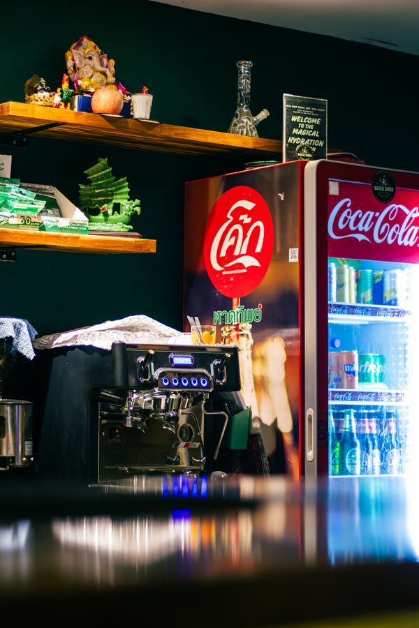 Drinks cooler and coffee machine behind the bar at Magical Garden, Ko Samui