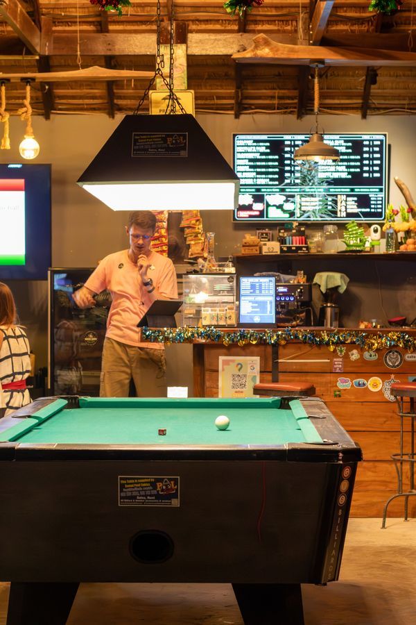 Karaoke and pool table setup at MG Bistro gaming area, Ko Samui