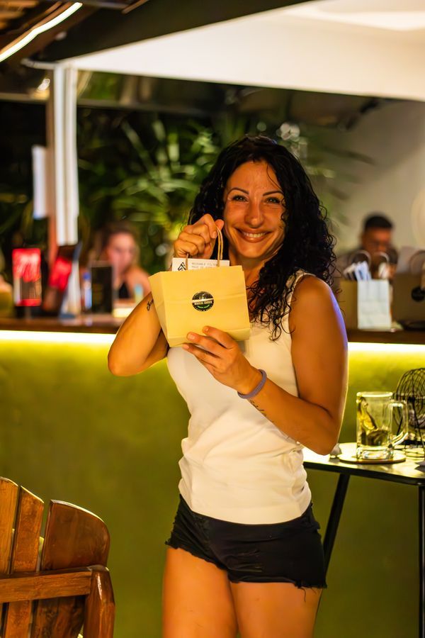 Customer holding a cannabis purchase bag at Magical Garden, Ko Samui