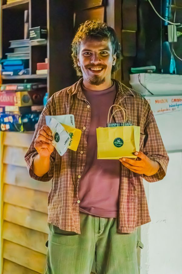 Customer holding cannabis products at Magical Garden, Ko Samui