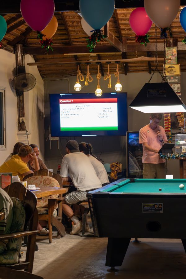 Customer enjoying billiards during a fun night at MG Bistro, Ko Samui