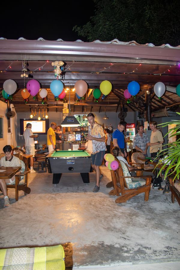Evening lounge with pool table and balloons at MG Bistro, Ko Samui