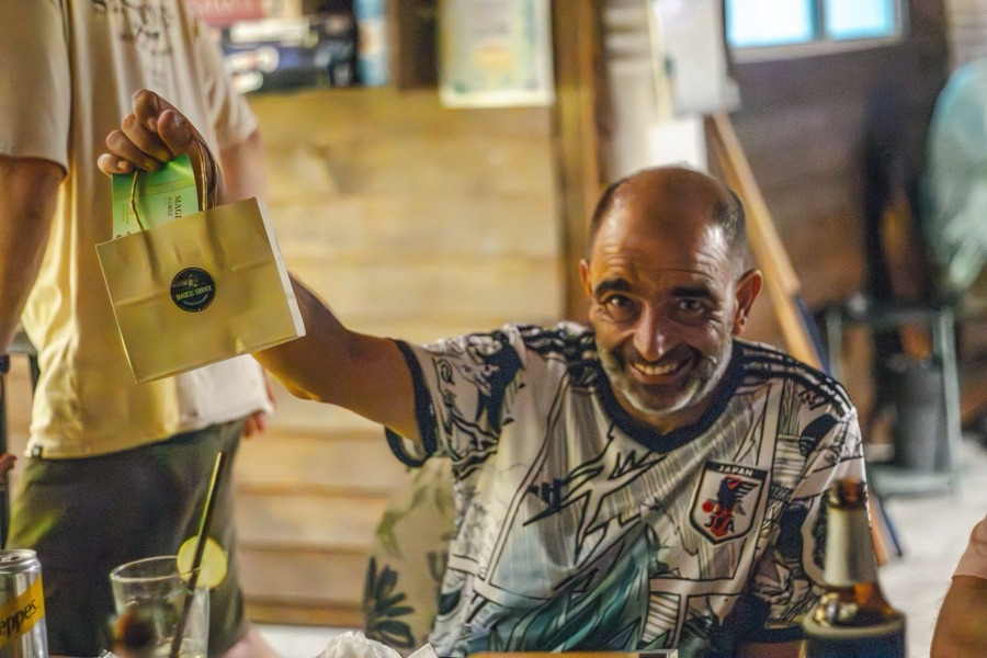 Smiling guest with cannabis bag at Magical Garden, Ko Samui