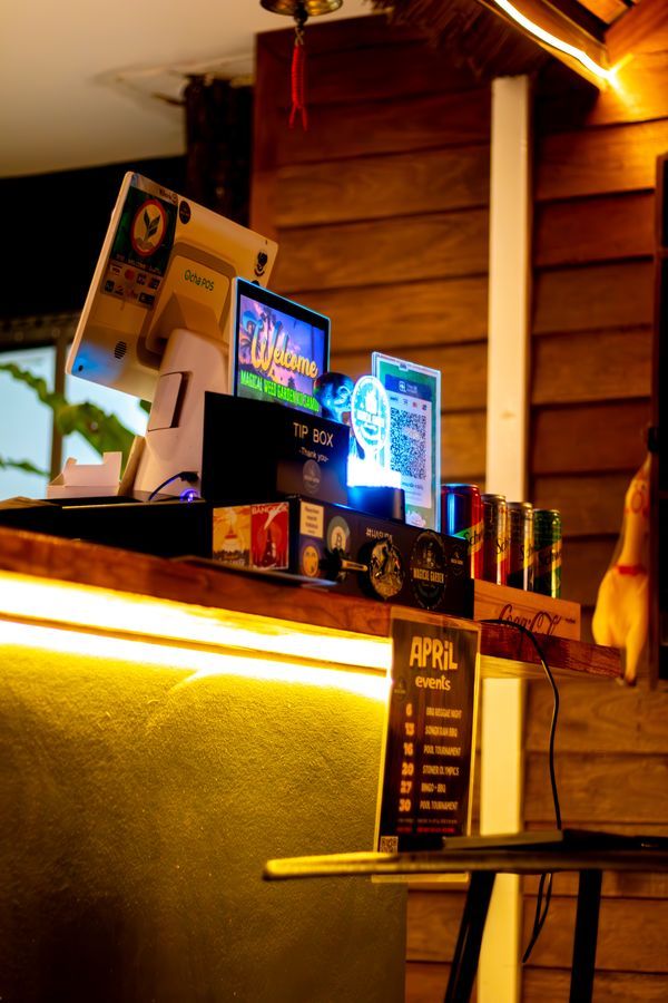 Welcome sign and wood counter display at Magical Garden, Ko Samui